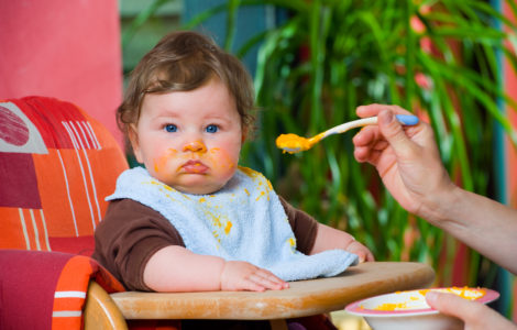 Baby eating pumpkin